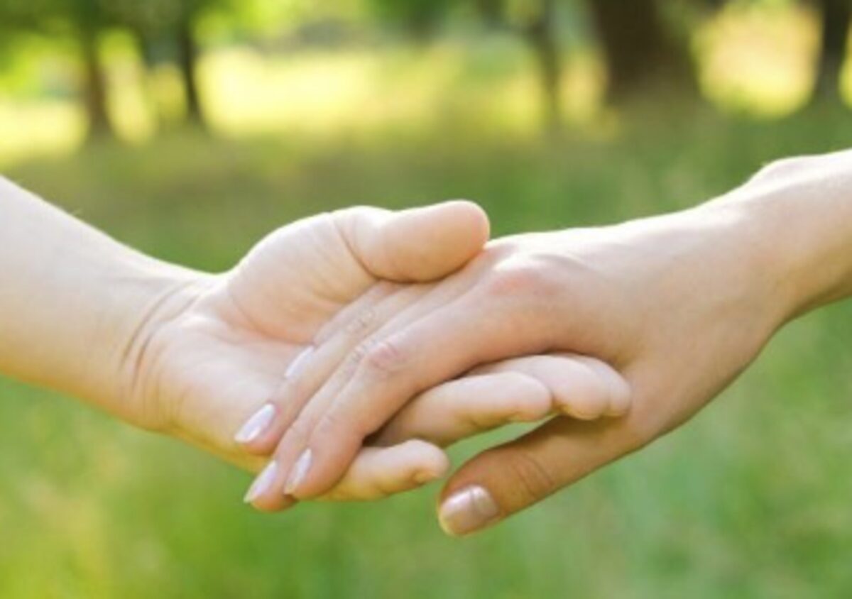 Two hands clasped together